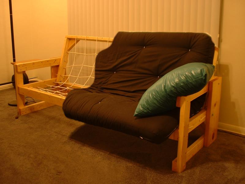 wooden futon with black cushion
